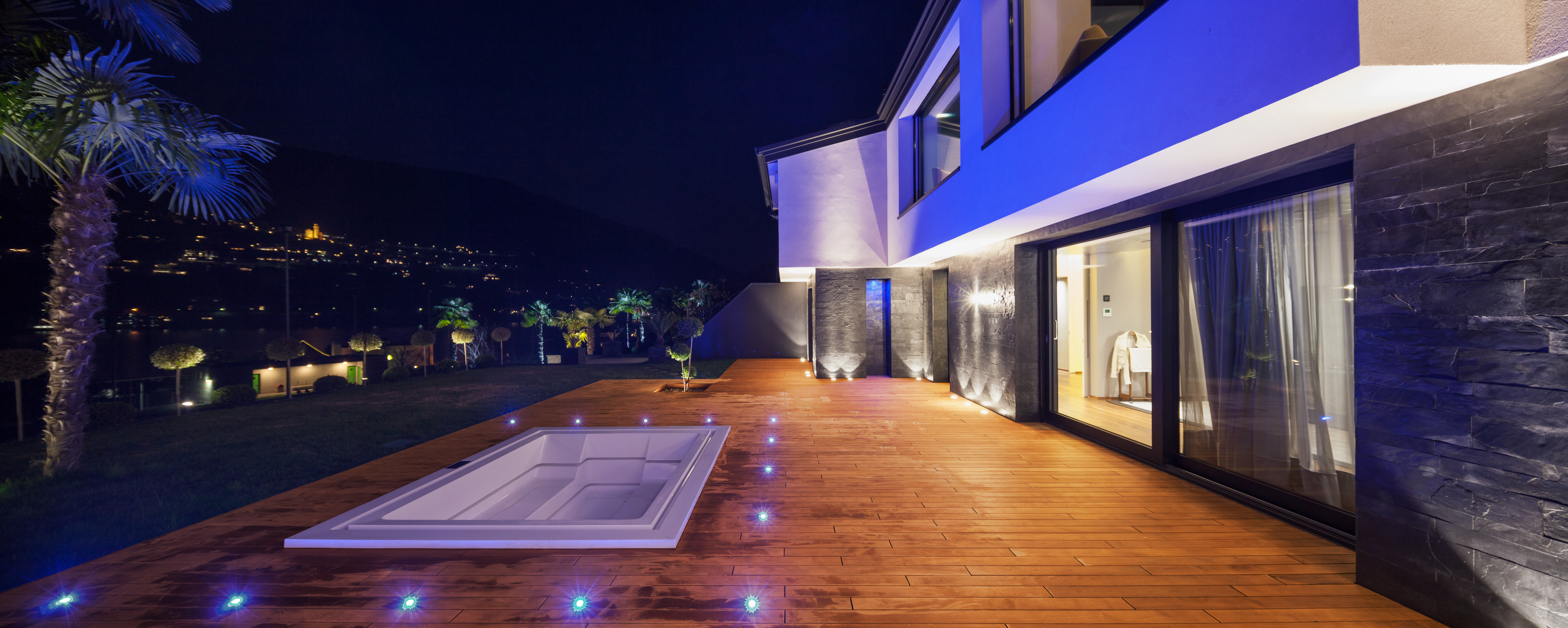 View of modern villa in the night with pool